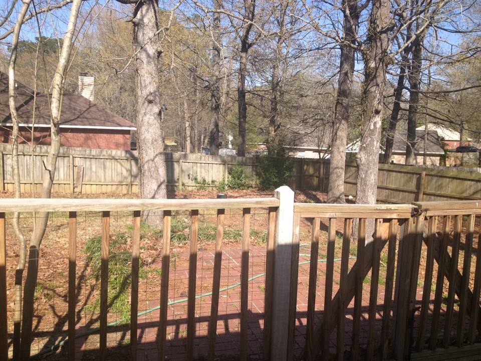 deck to patio and fenced back yard